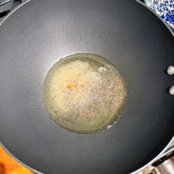 Mustard seeds and asafetida in oil/Bhindi ki Sabzi