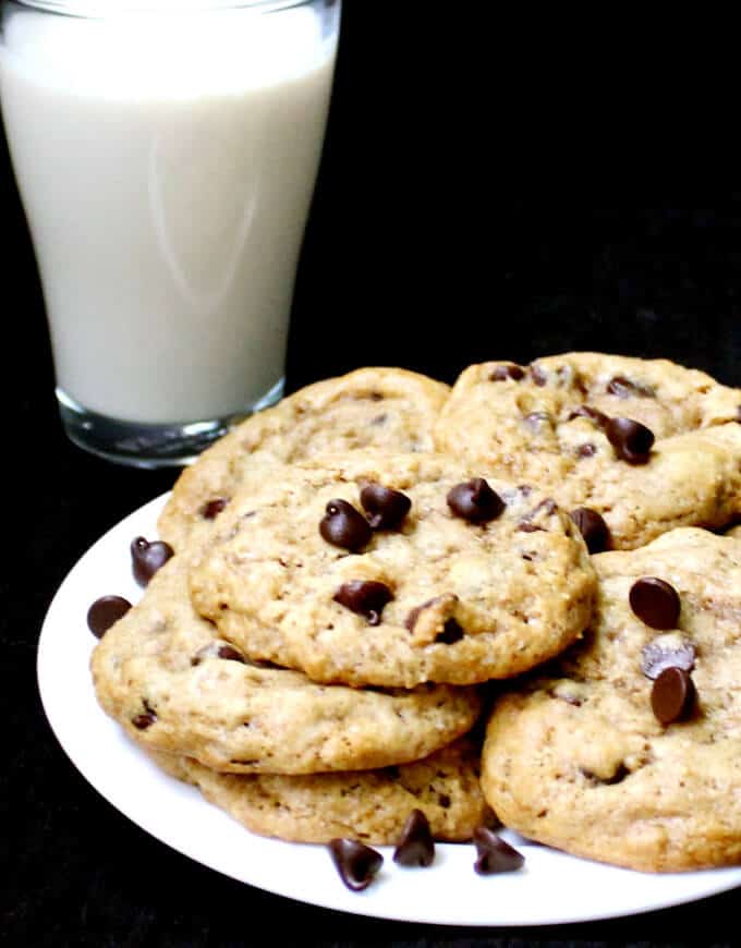 Dairyfree eggless chocolate chip cookies with a glass of milk.