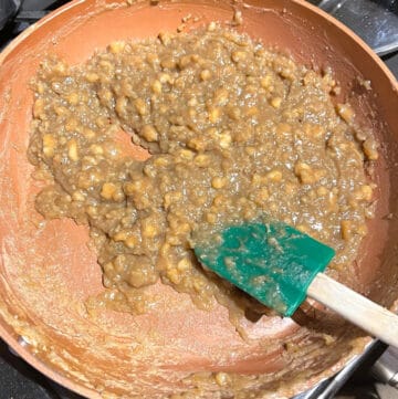 Reduced kalakand mixture in saucepan.