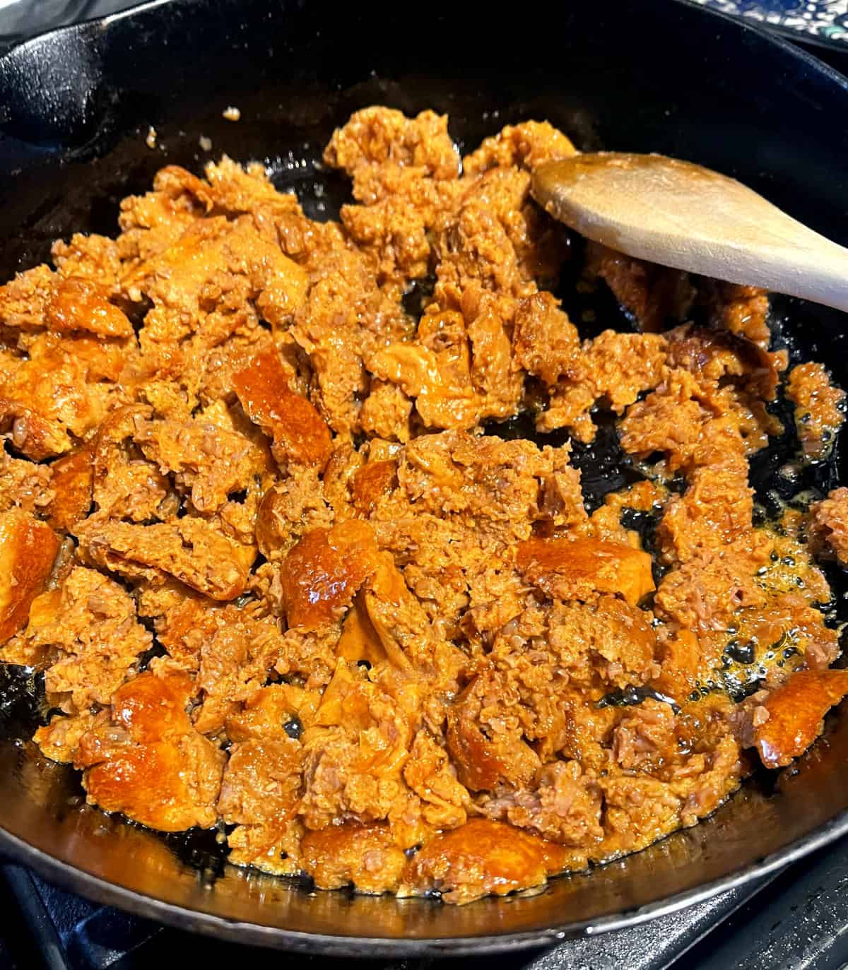 Sausage crumbled into skillet.