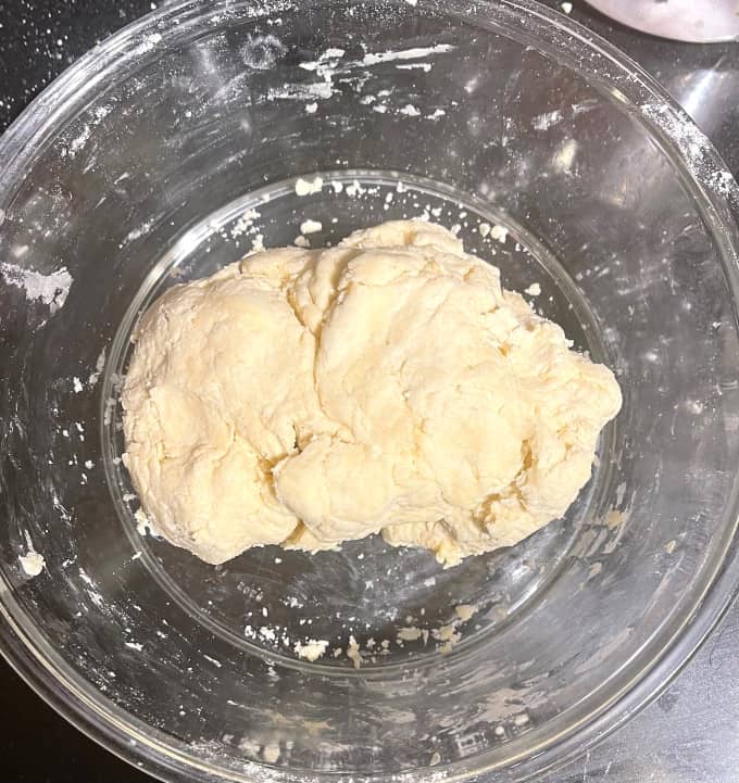 Pie dough prepared in glass bowl.