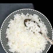 Basmati rice in bowl with text that says "how to cook fluffy basmati rice".