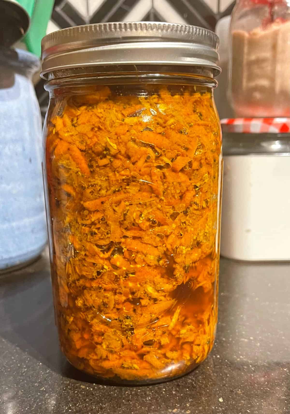 Carrot pickle or gajar ka achar in mason jar.