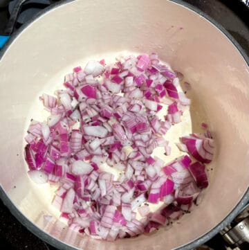 Onions sauteing in dutch oven.