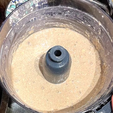 Pancake batter blended in food processor bowl.