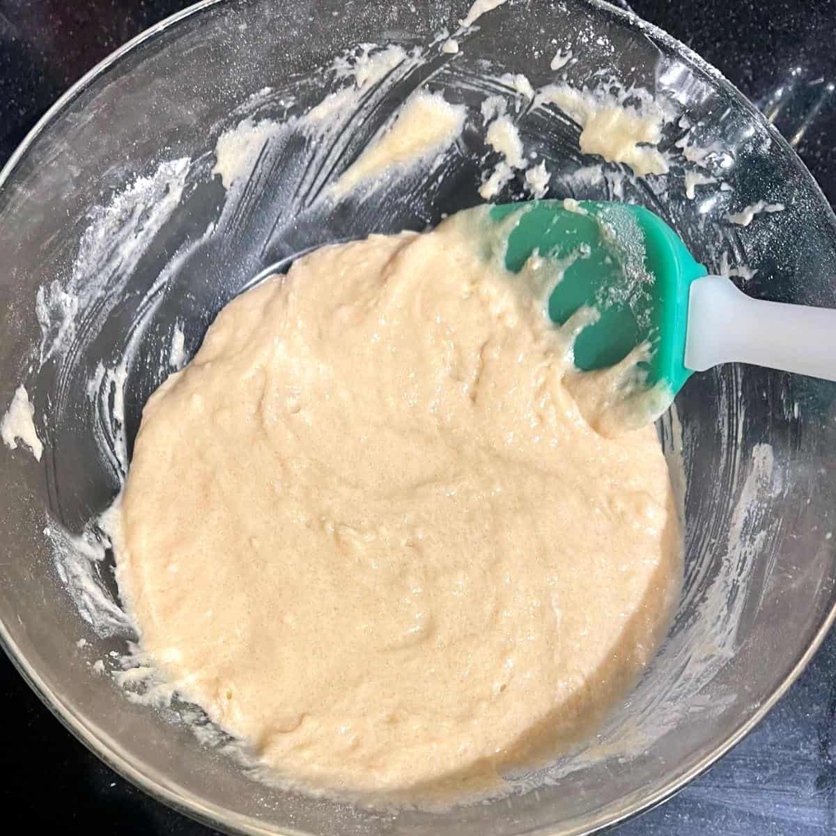 Cake batter in bowl with spatula.
