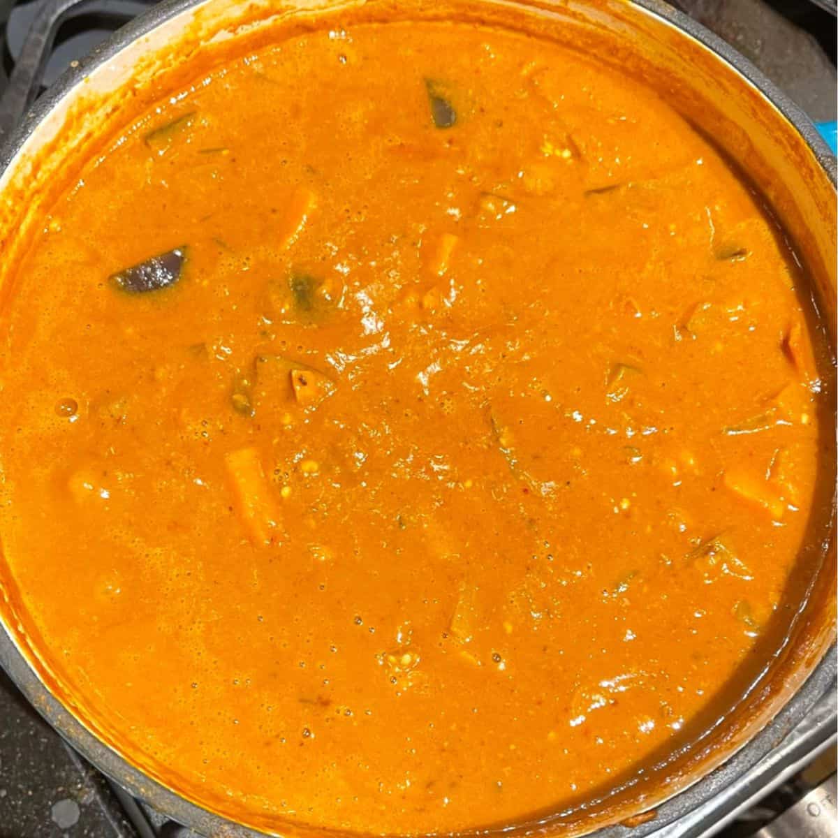 Cooked African peanut stew in Dutch oven.