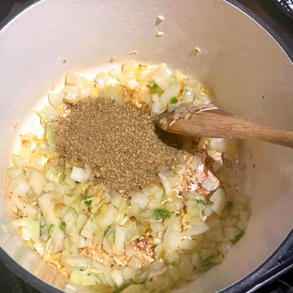 Spices added to Dutch oven with onions.