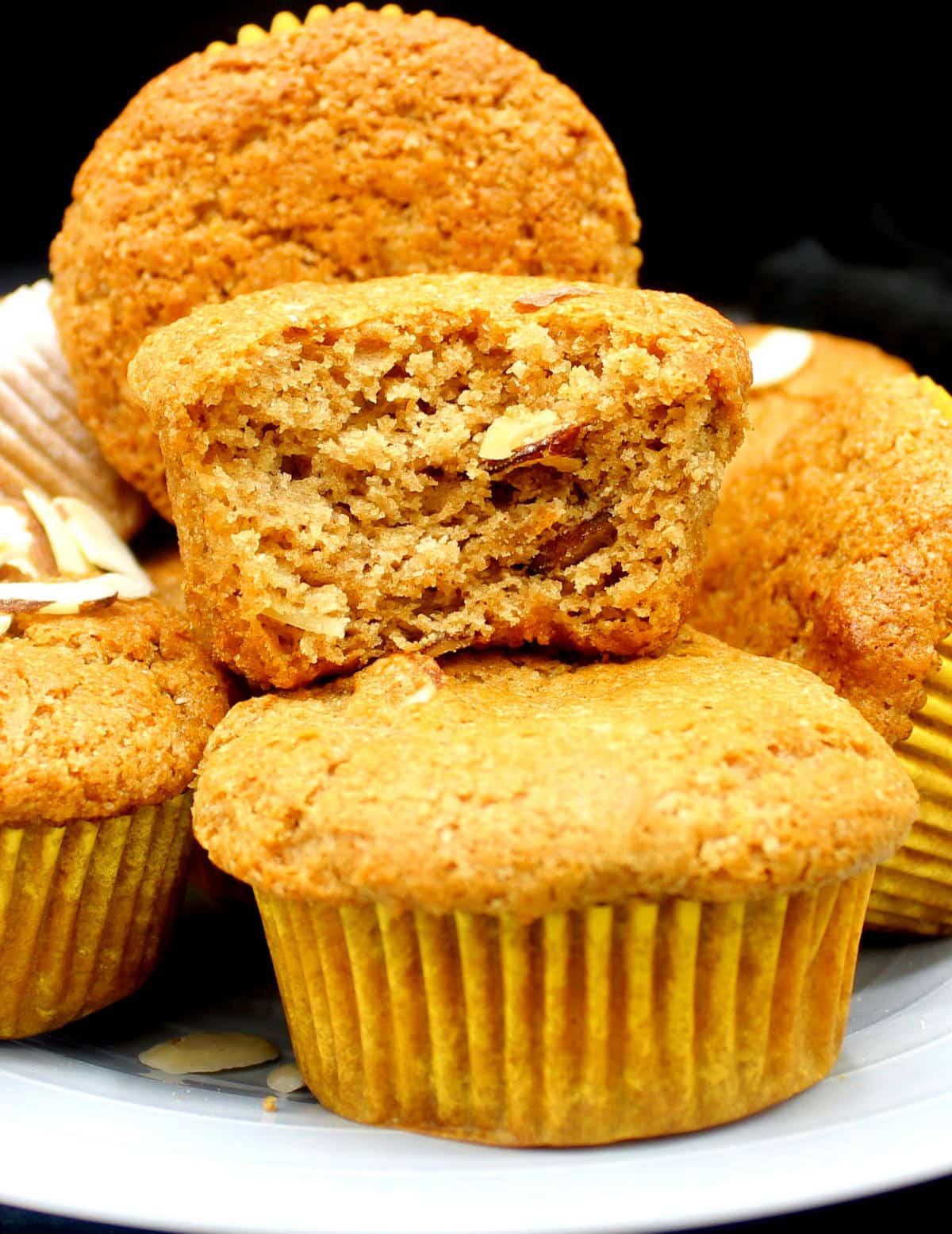Image showing the moist, tender crumb of vegan applesauce muffin.