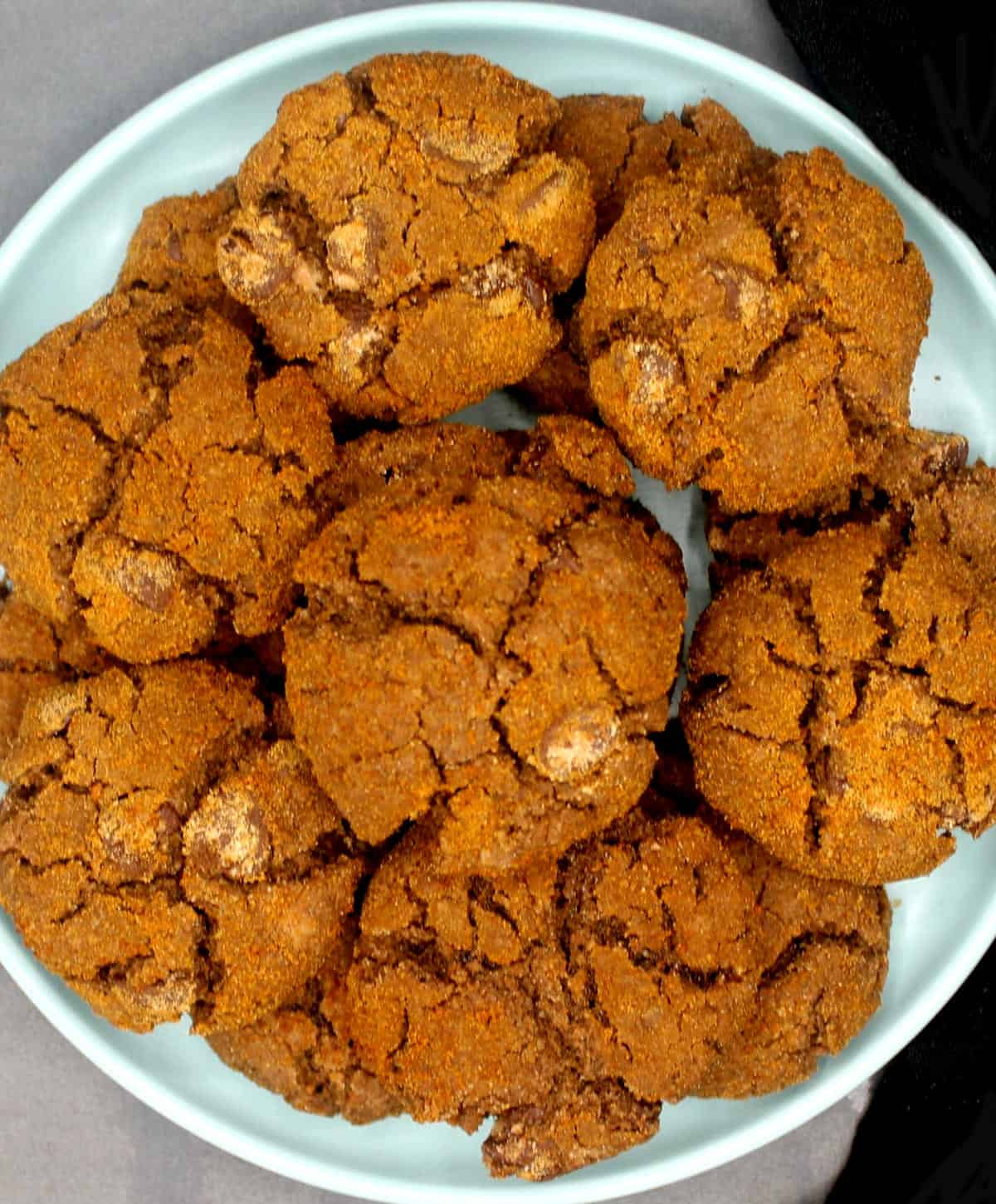 Vegan chocolate ginger cookies in blue plate.