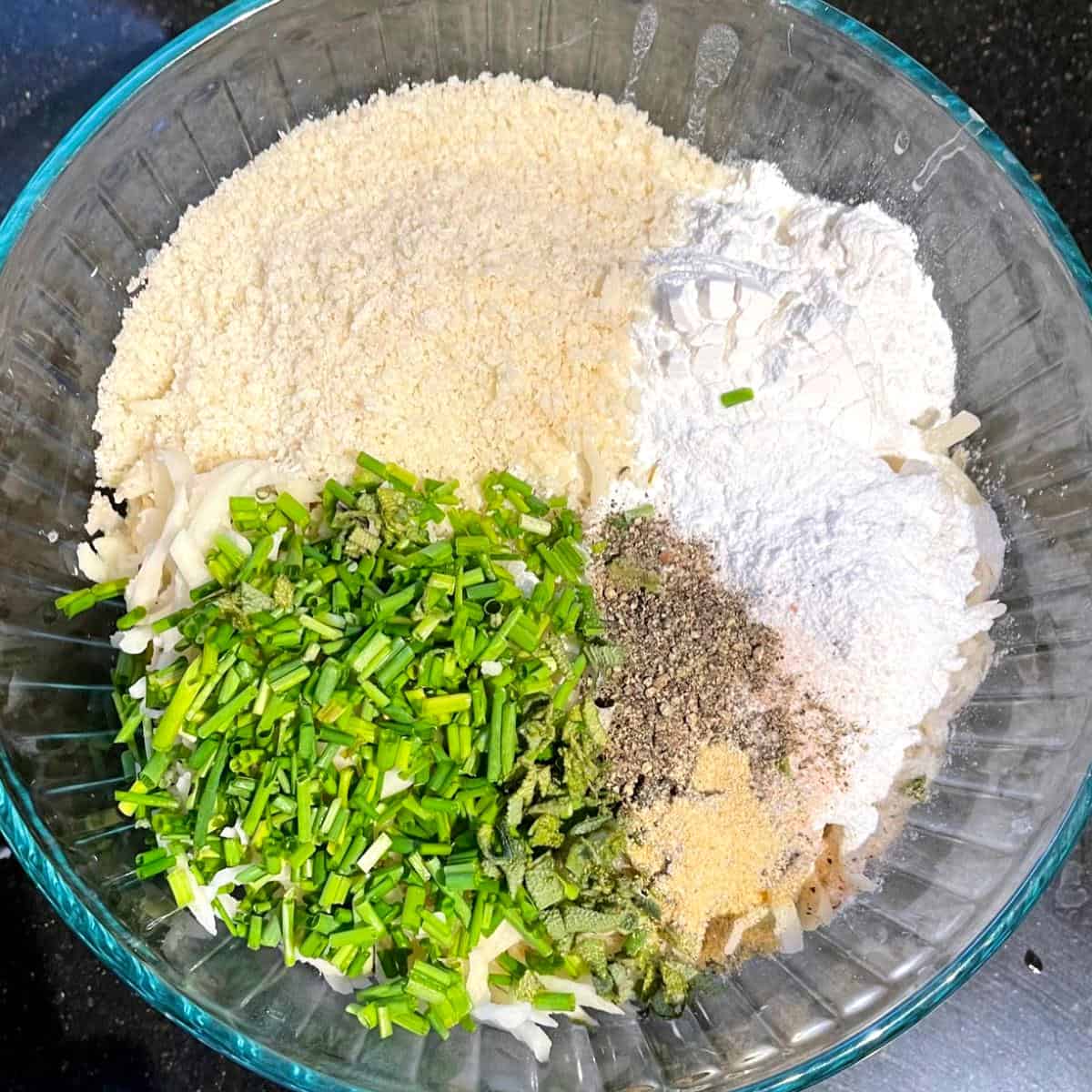 Ingredients for latkes in bowl.