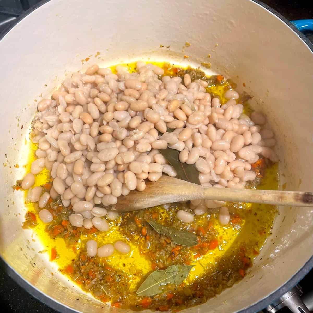 Beans added to pot with sofrito veggies.