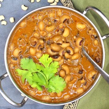 Black-eyed peas curry with cilantro in karahi bowl.