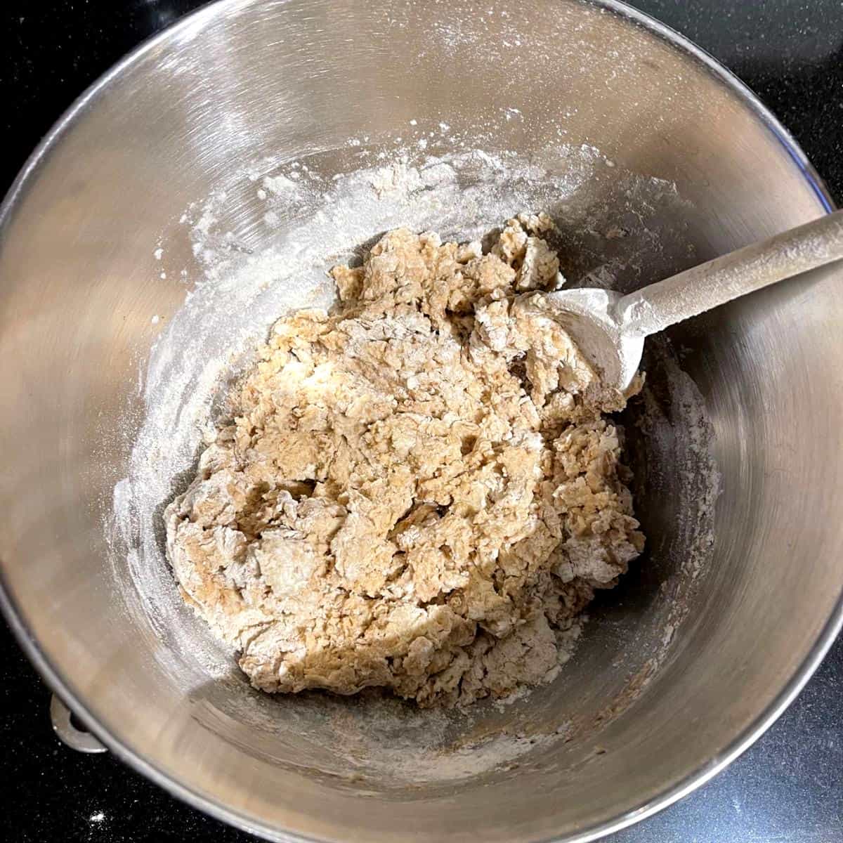 Shaggy dough for oatmeal bread in bowl.