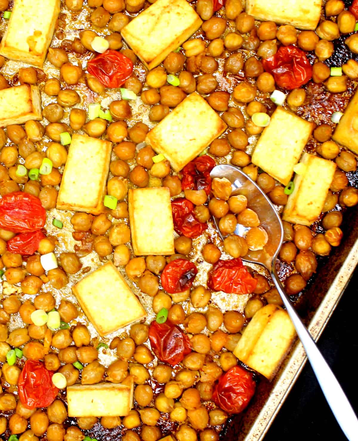Sheet pan tofu with chickpeas and cherry tomatoes.