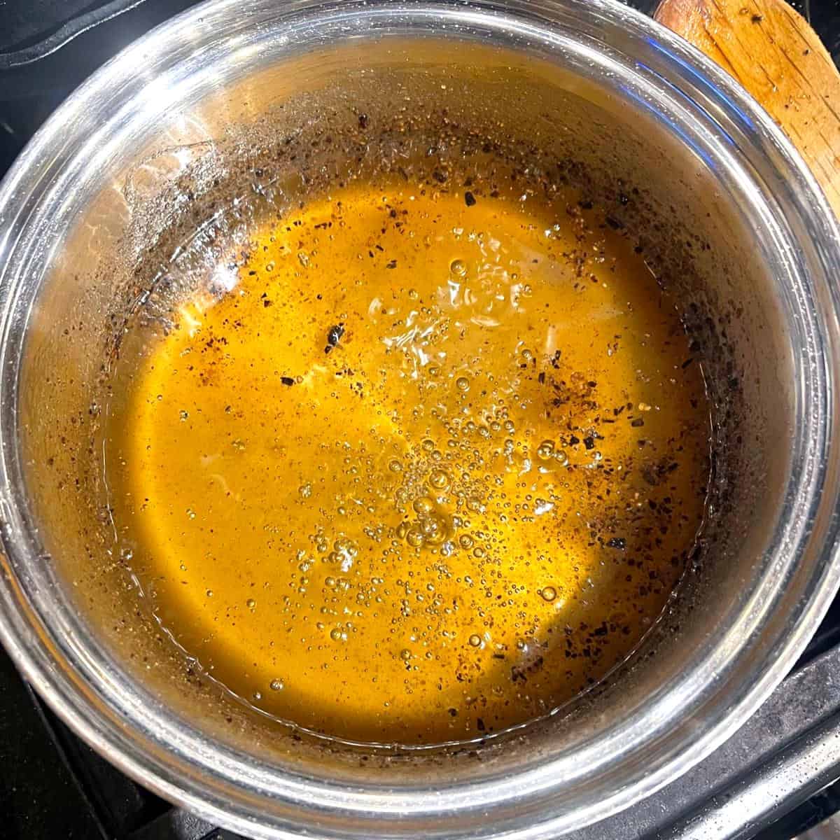 Cooked sugar syrup for vegan baklava in saucepan.