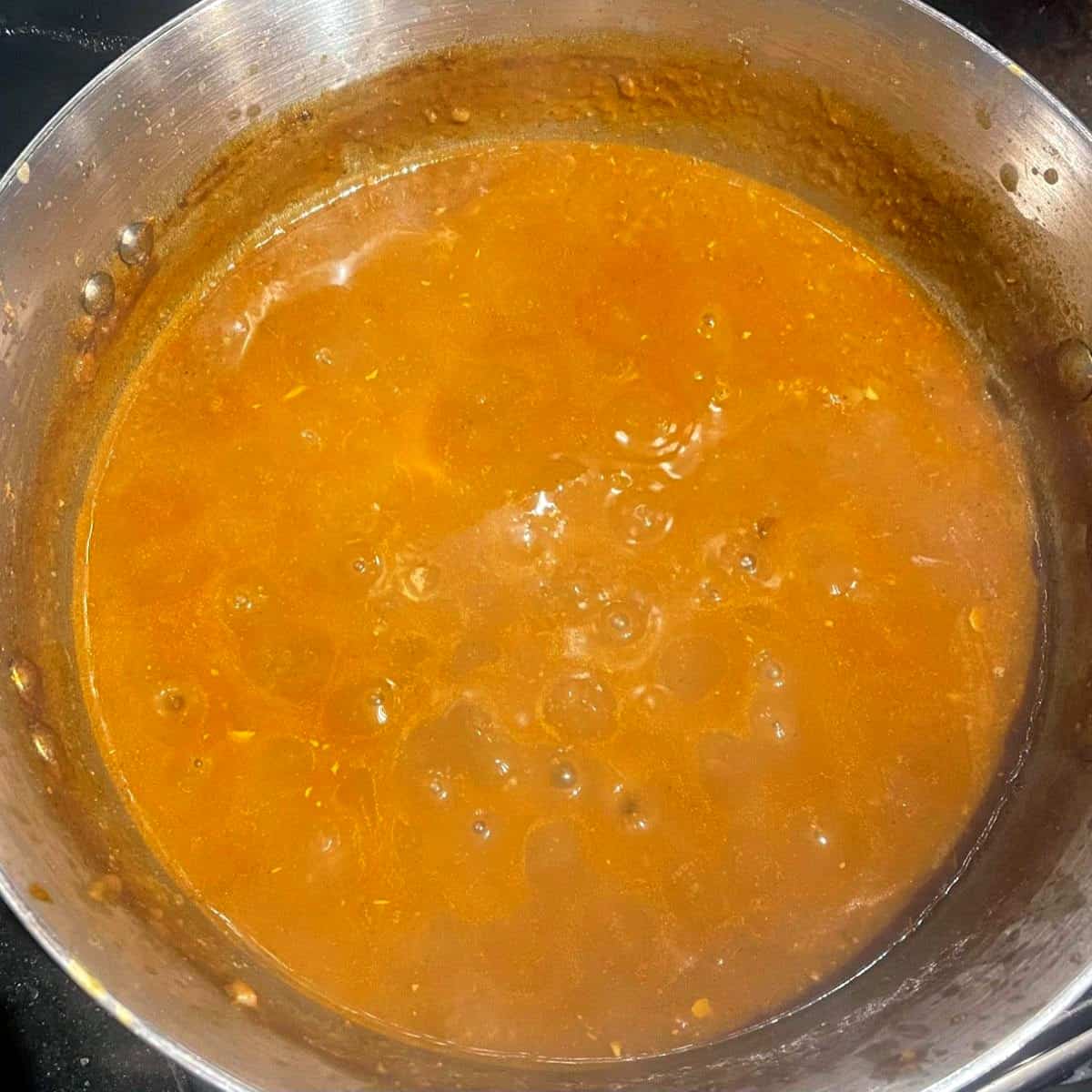 Ethiopian lentil stew simmering on stove.