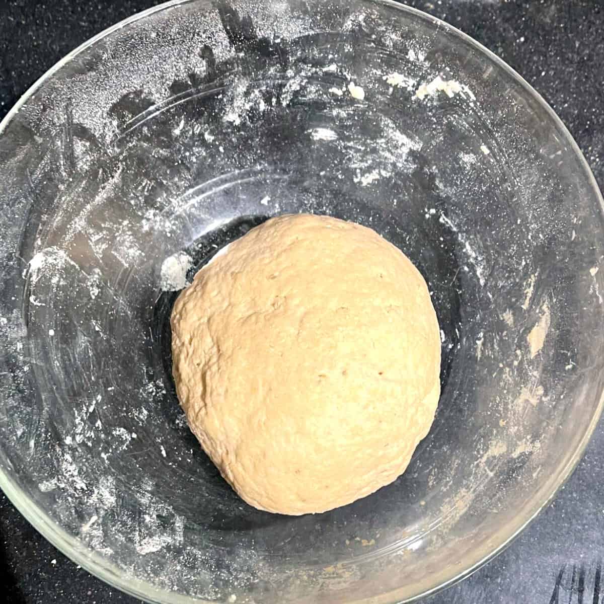 Dough for gobi paratha after kneading in glass bowl.