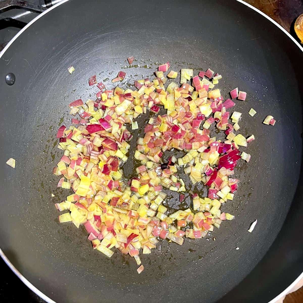 Onions sauteing in wok in niter kibbeh.