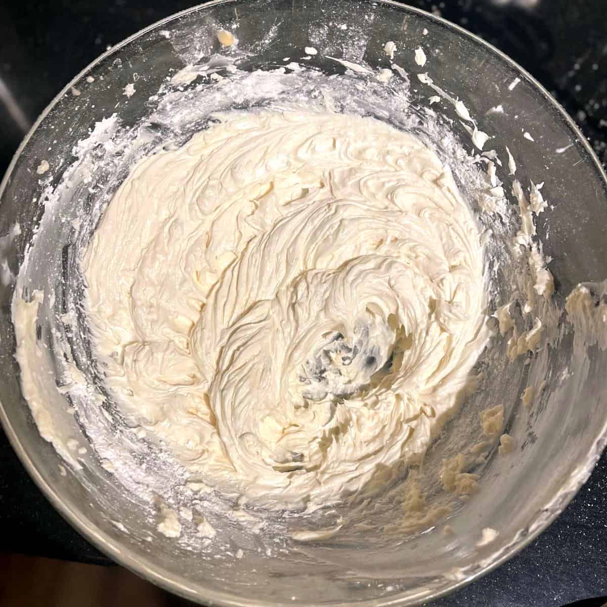 Whipped vegan vanilla batter in a glass bowl.
