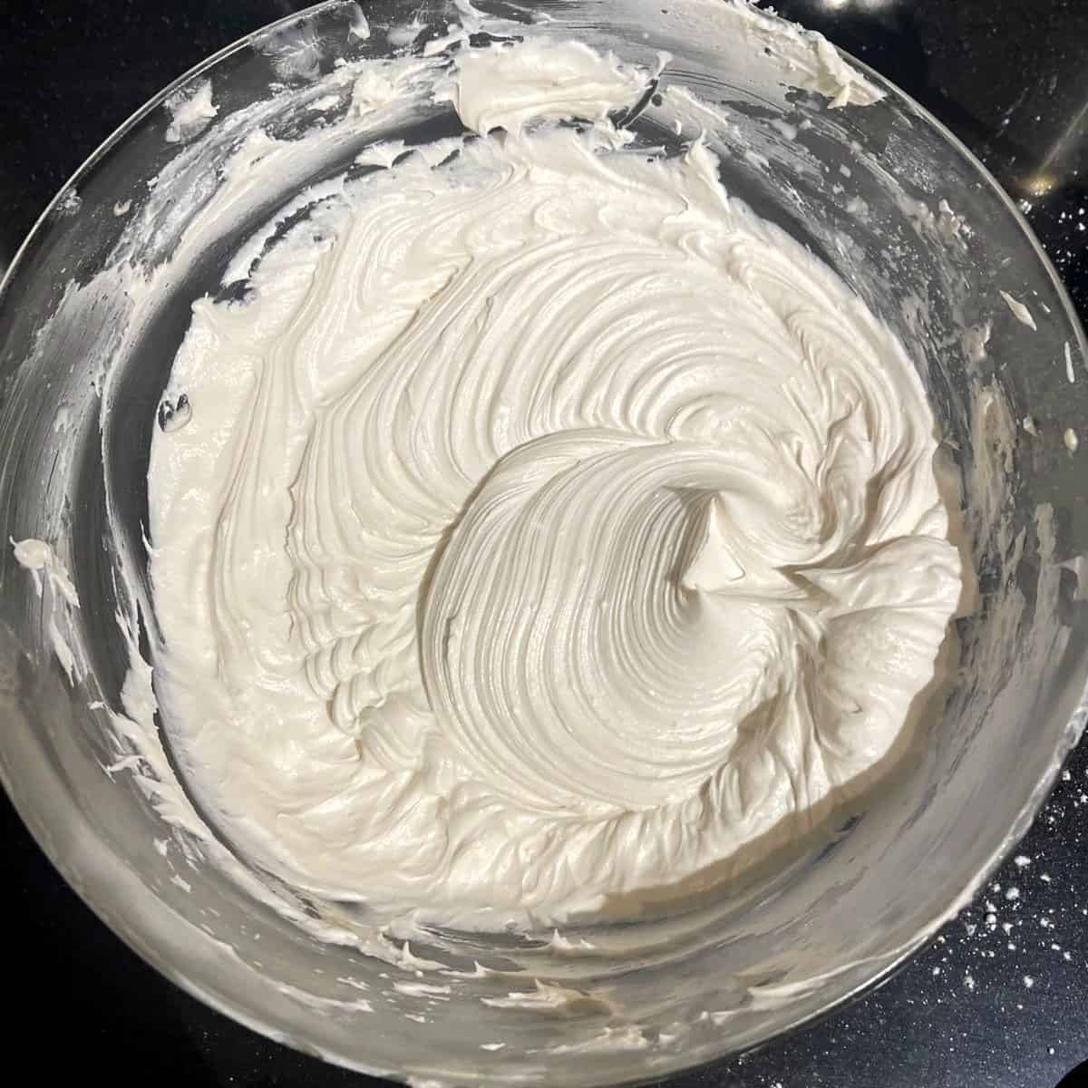 Final vegan vanilla buttercream frosting in bowl.