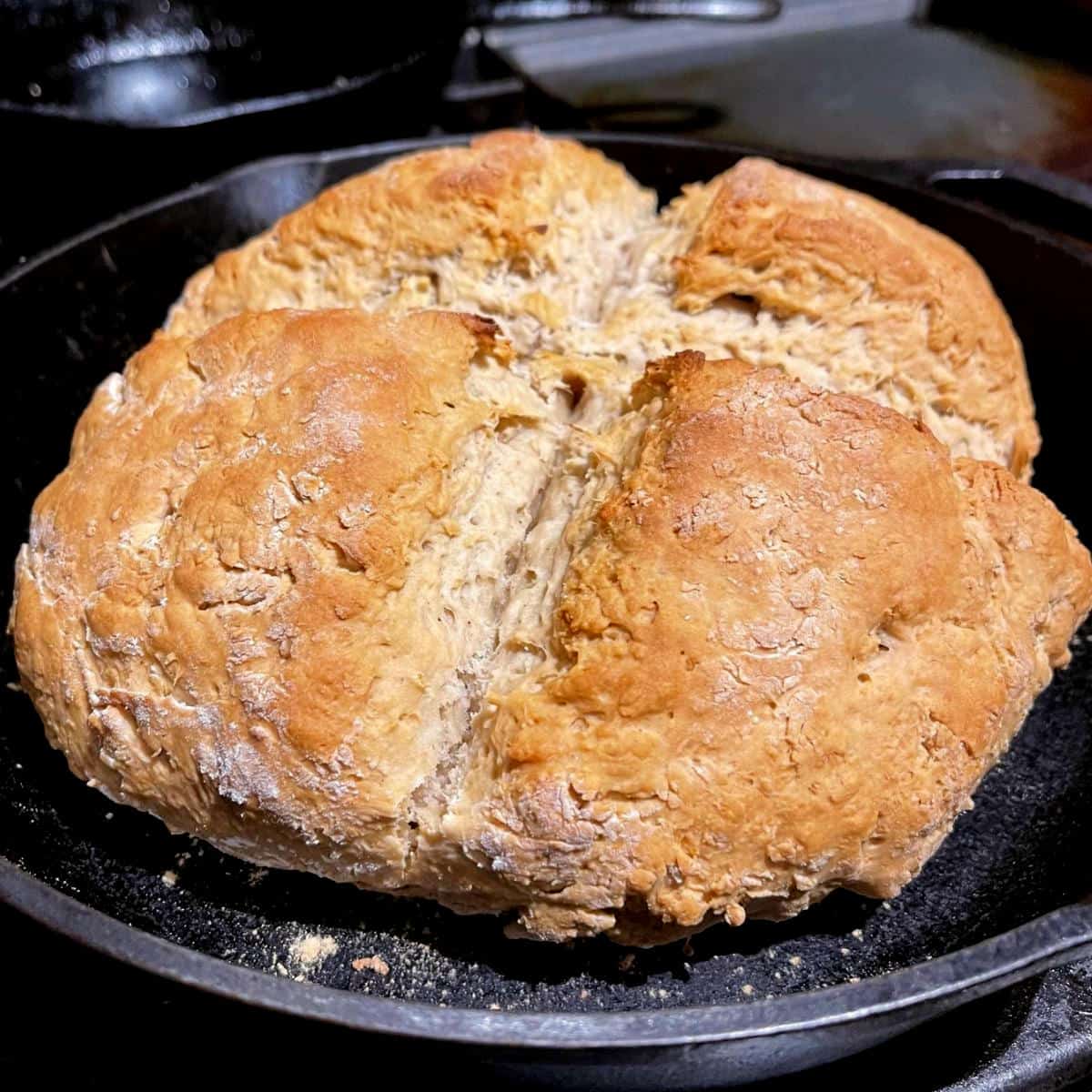 Vegan Irish soda bread in cast iron pan.