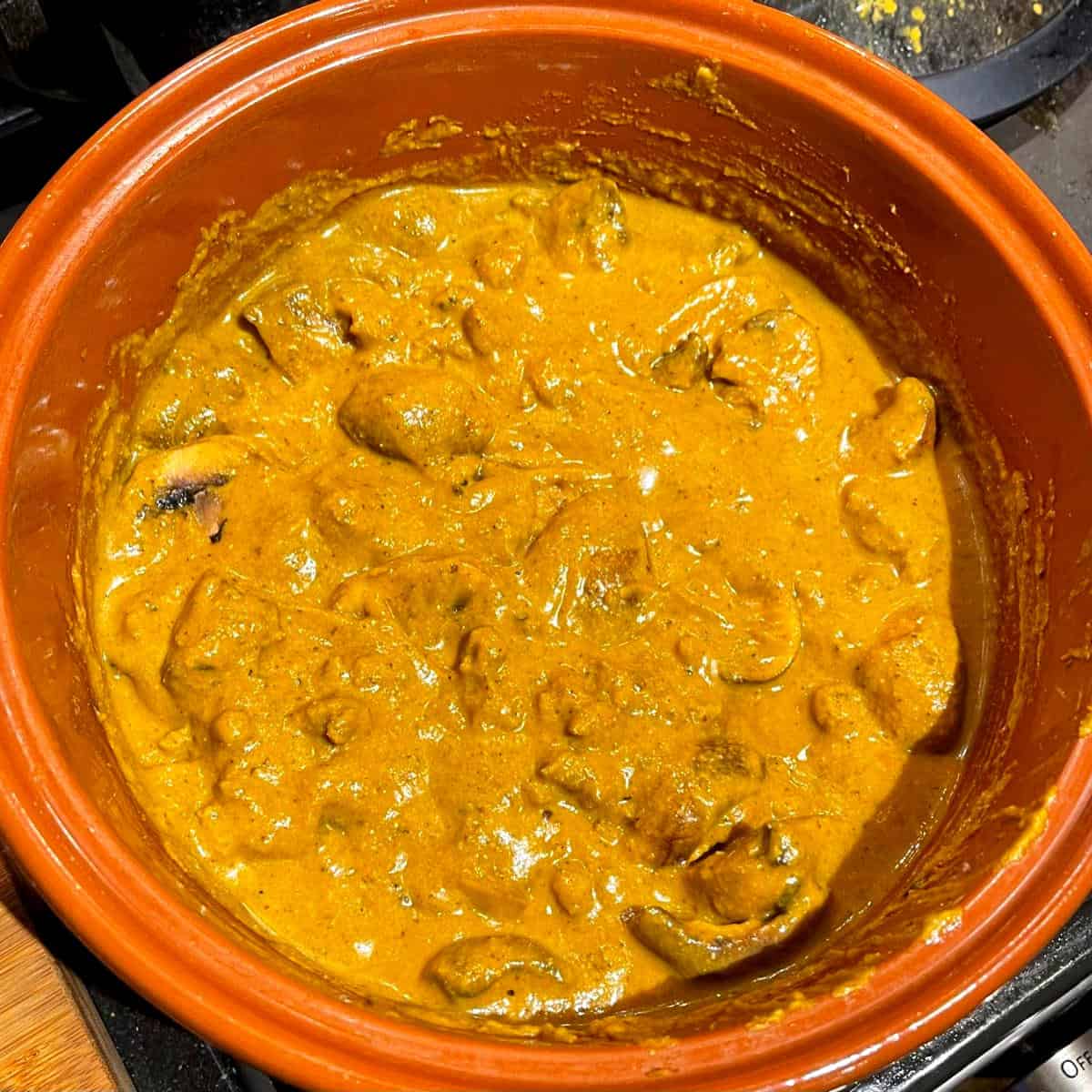 Mushrooms and seitan mixed with sauce in seitan curry.
