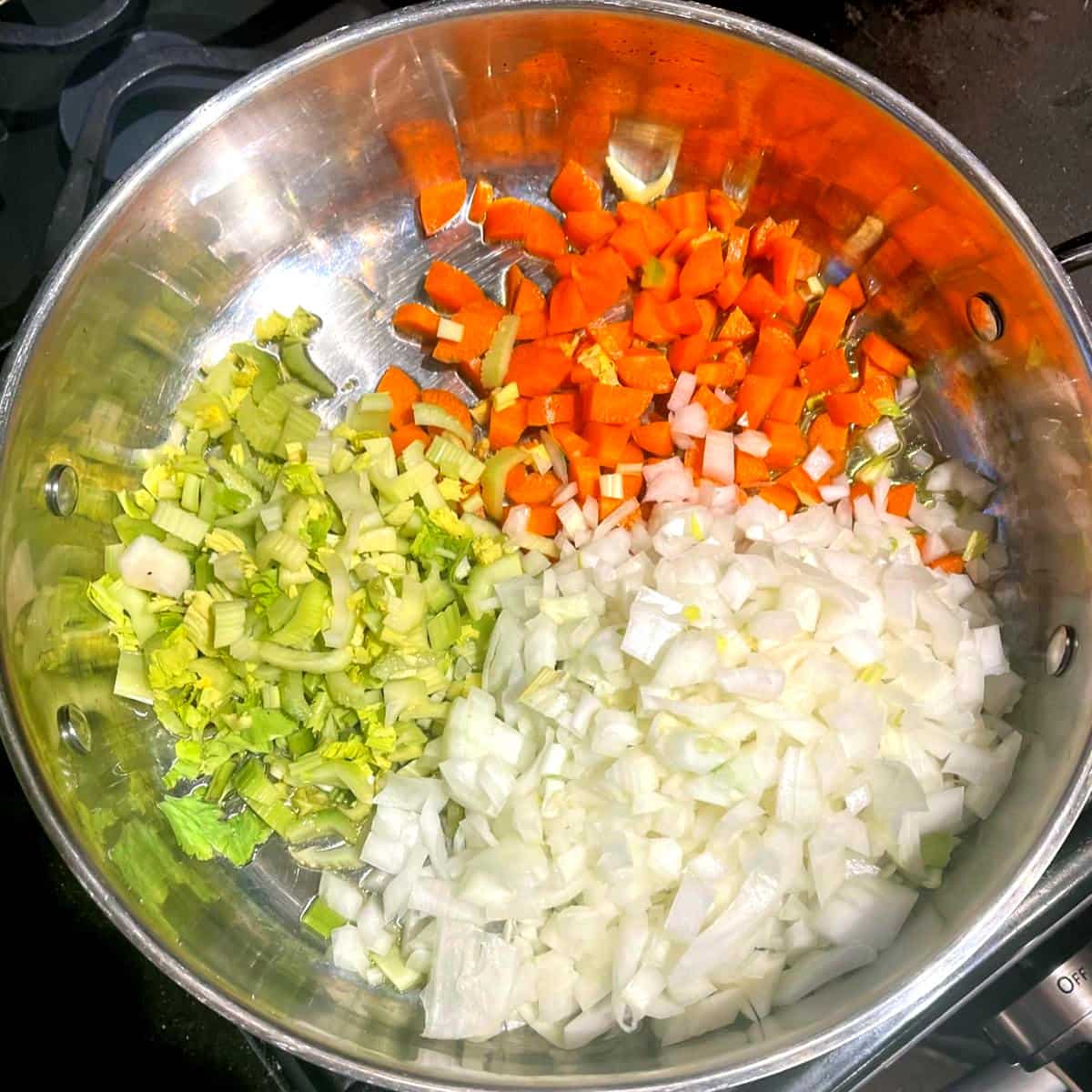 Celery, carrots and onions added to skillet.