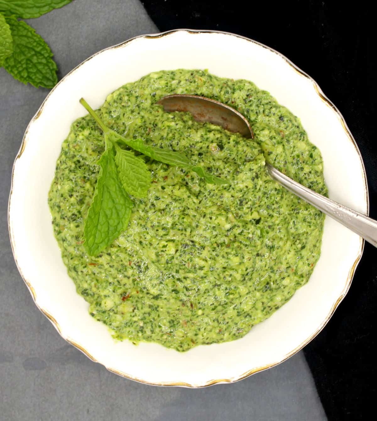 Vegan mint pesto in bowl with spoon.