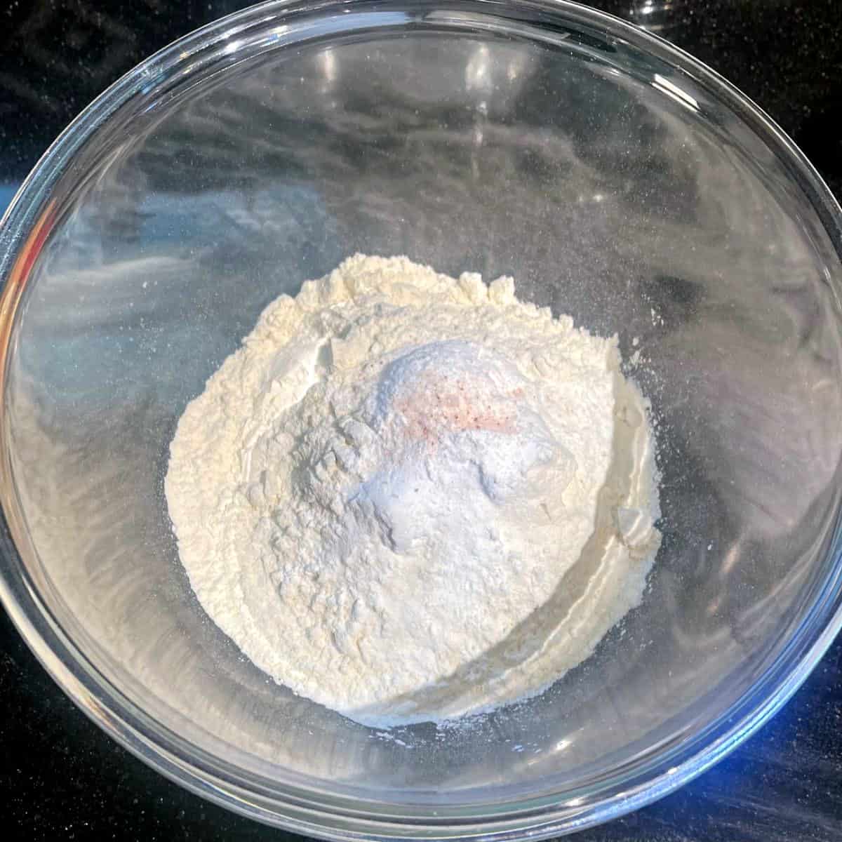 Dry ingredients for vegan rhubarb muffins in bowl.