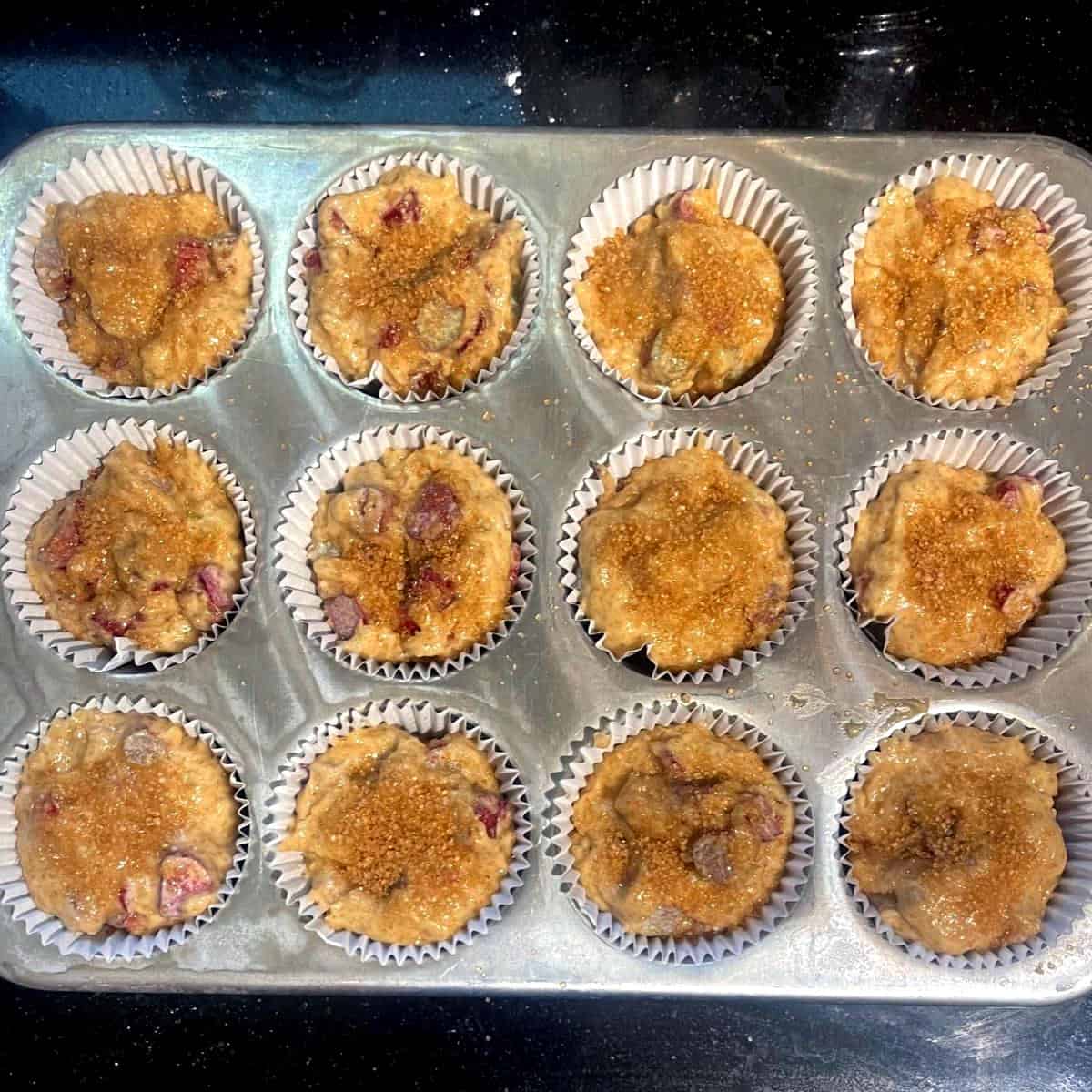 Vegan rhubarb muffins before baking in muffin tin.