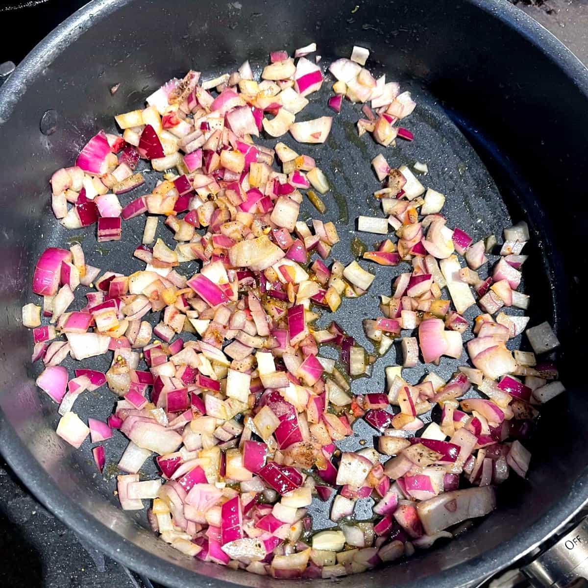 Onions sauteing for khoresh bademjan.