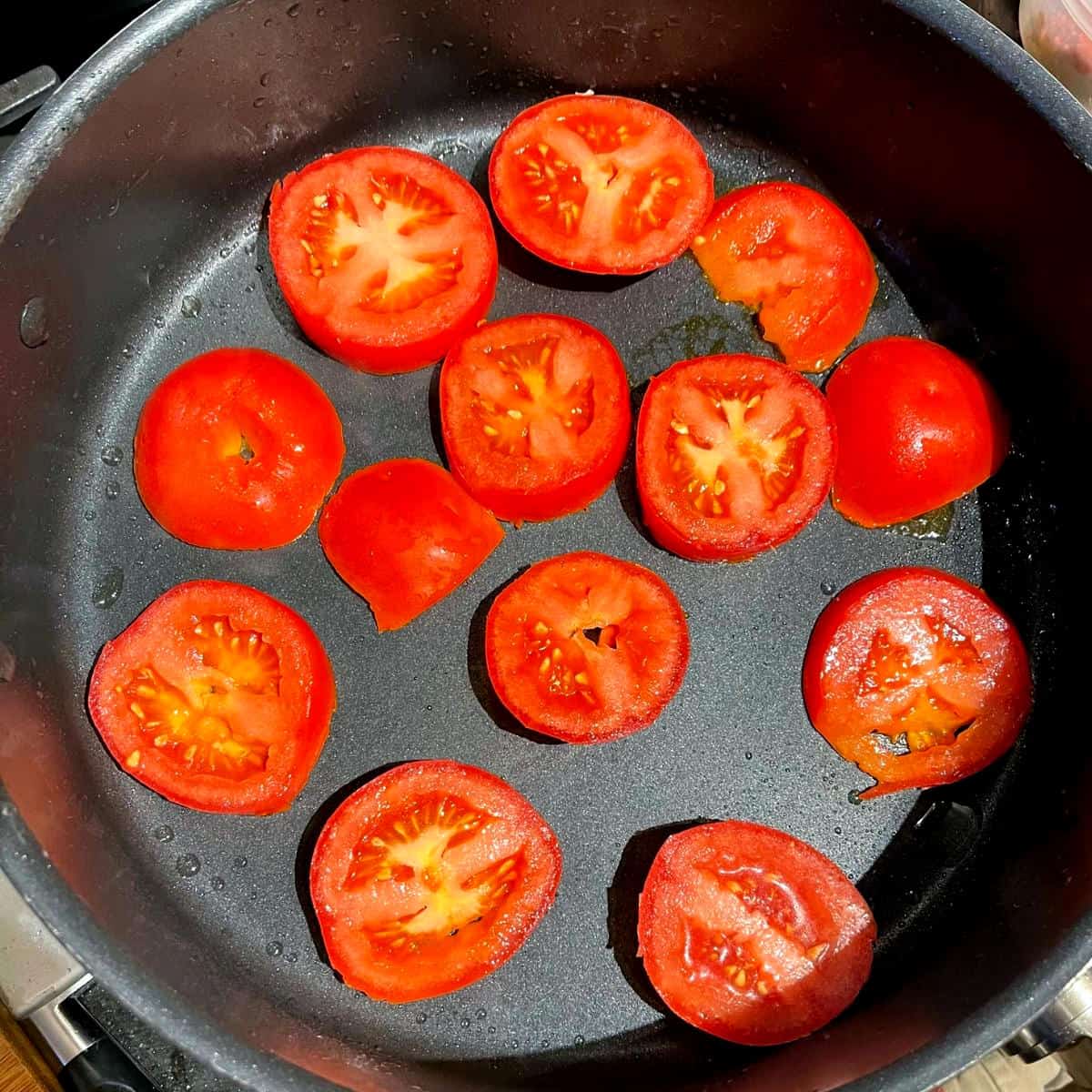 Tomatoes in saucepan for khoresh bademjan.
