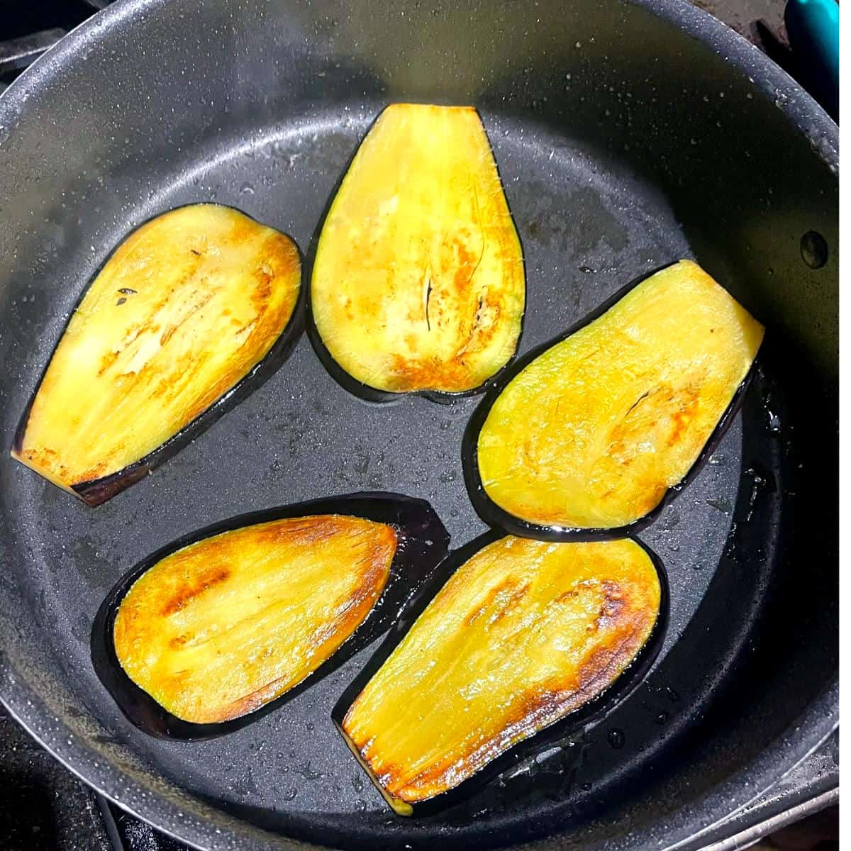 Eggplants frying for vegan moussaka.