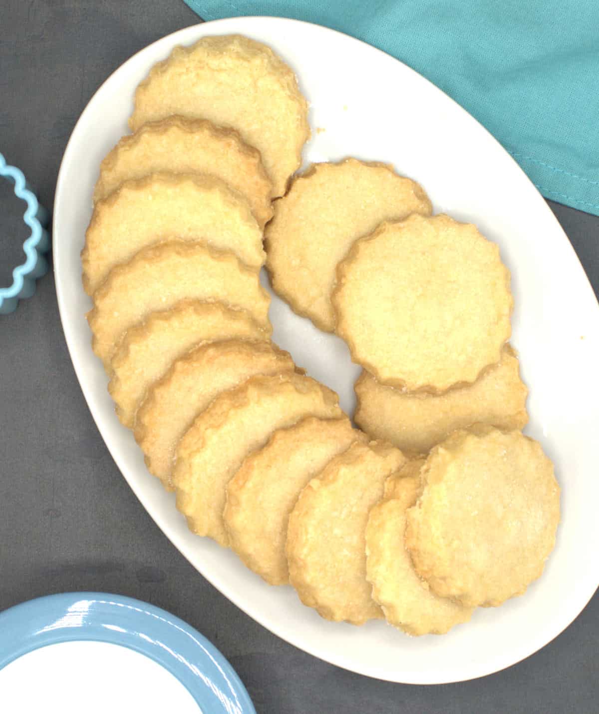 Vegan sable cookies in white plate.