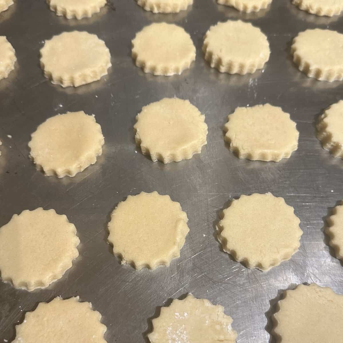 Vegan sable cookies on baking sheet before baking.