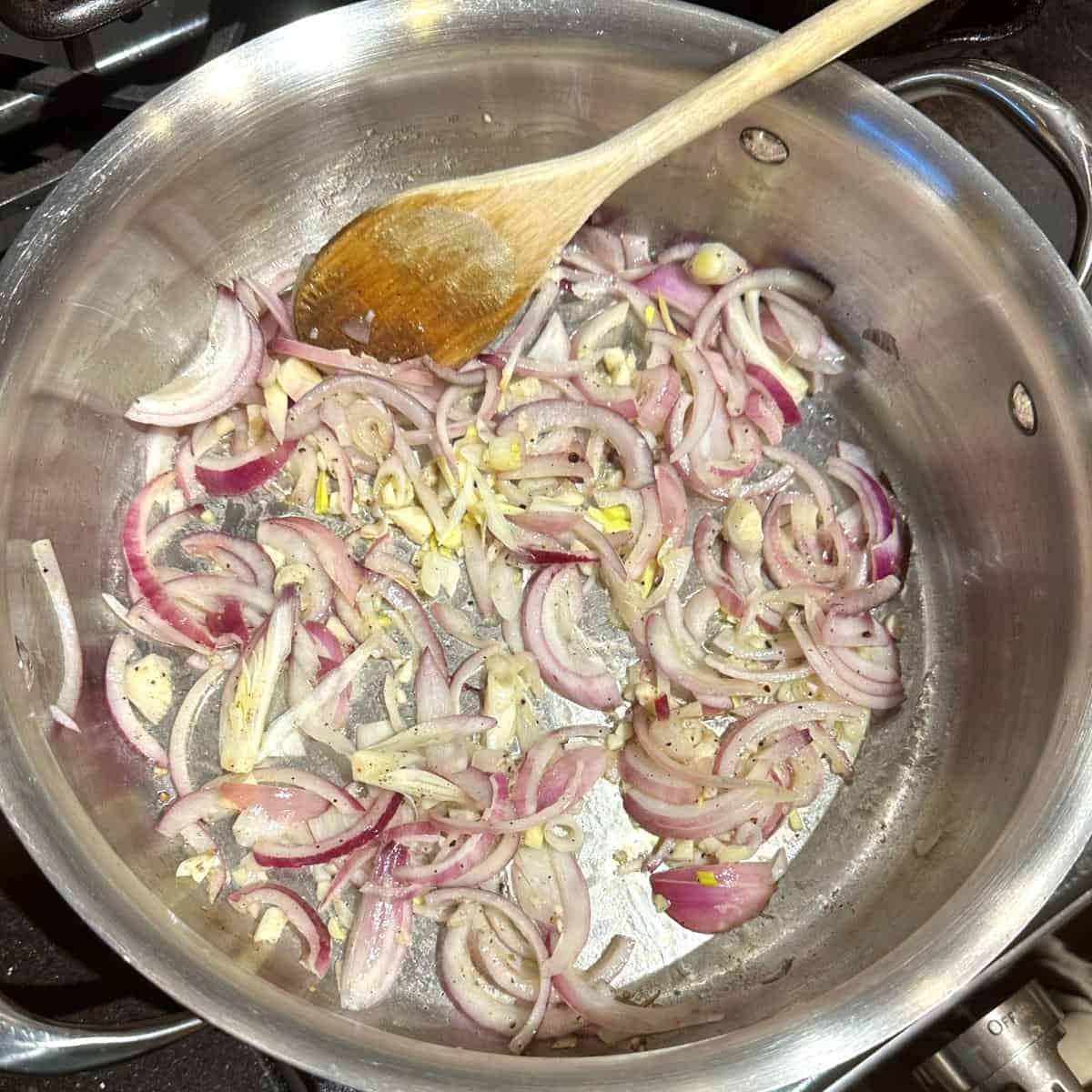 Onions and garlic sauteing in olive oil.