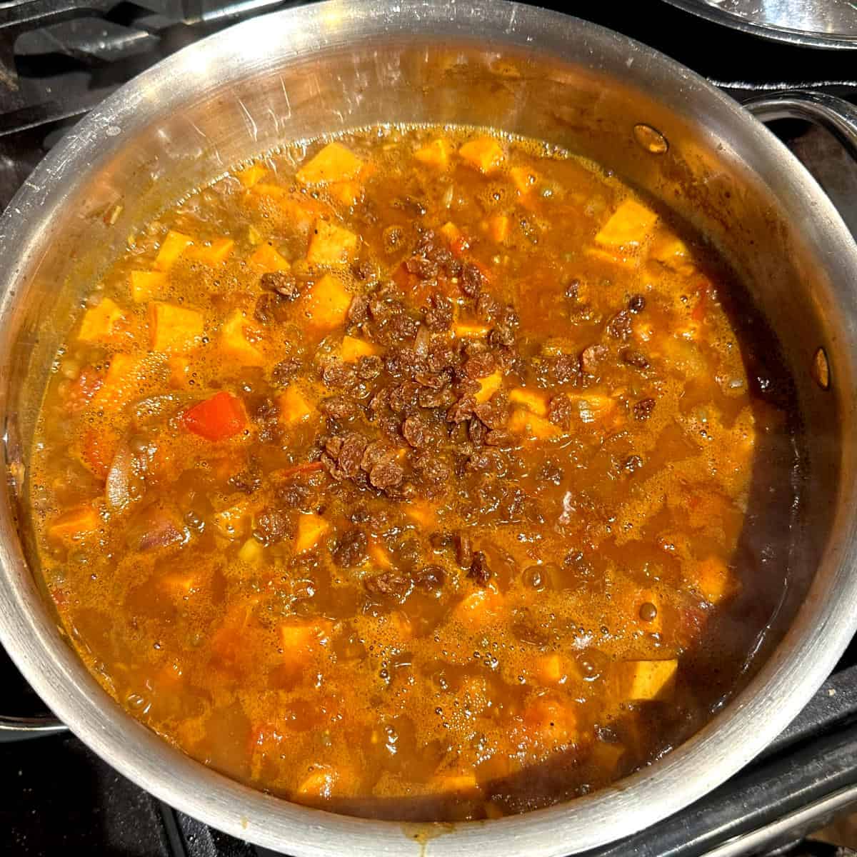 Lentils and sweet potatoes simmering for 15 minutes.