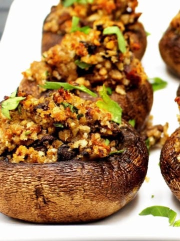 Vegan stuffed mushrooms on plate.