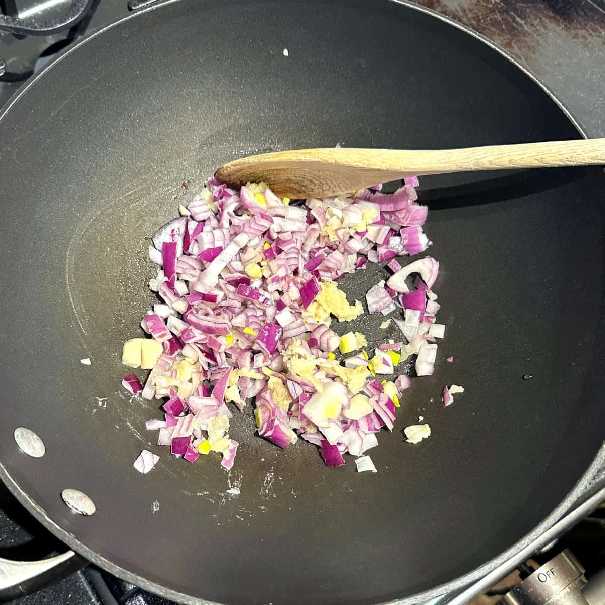 Garlic and onions sauteing in olive oil.