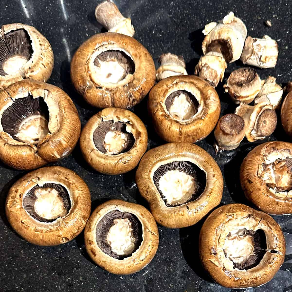 Mushroom caps and stems separated.