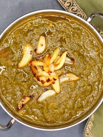 Photo of Indian mustard greens or sarson ka saag in karahi bowl.