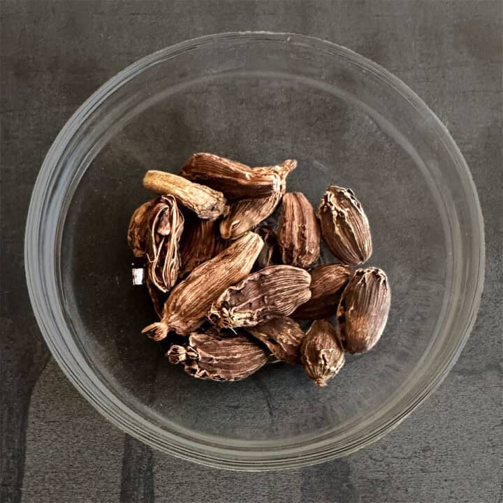 Bowl of black cardamom or badi elaichi.