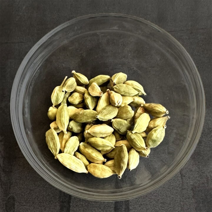 Bowl of green cardamom pods or hari elaichi.