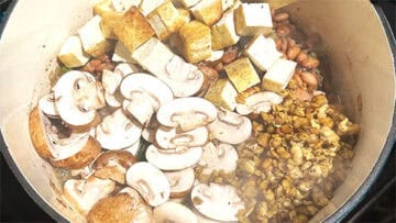 Mushrooms, tofu and tempeh added to pot.