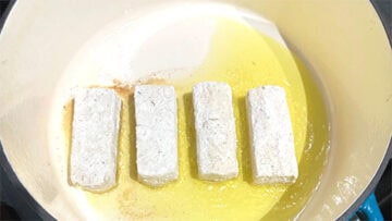 Tofu in pan.