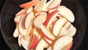 Sliced apples in bowl.