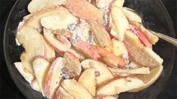 Apples mixed with flour, cinnamon, sugar, nuts and raisins.