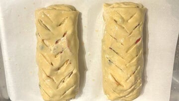 Vents cut into apple strudel logs.