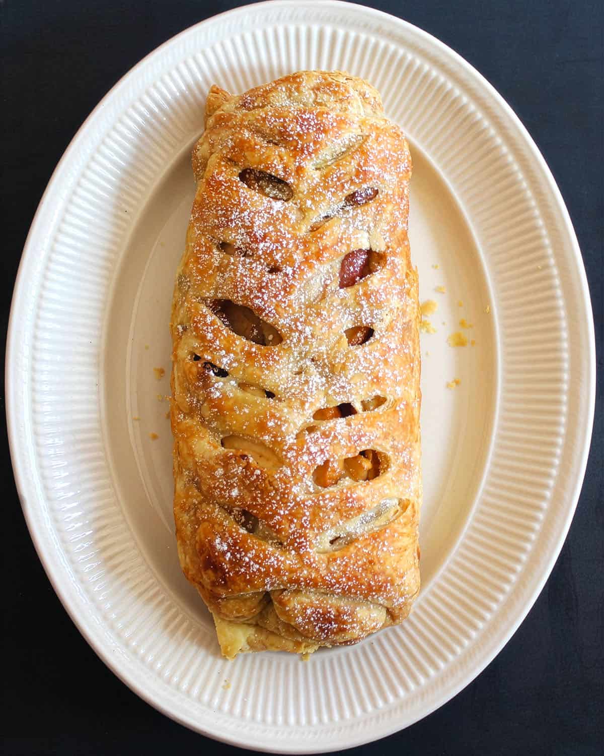 Top down view of vegan apple strudel in platter.